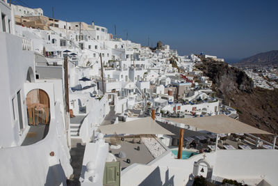 High angle view of buildings in town against sky