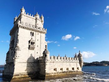 Low angle view of historical building against blue sky