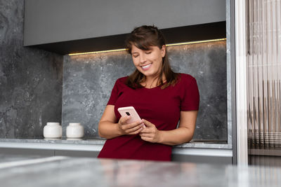 Young woman using mobile phone