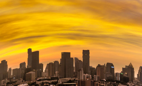 Cityscape against sky during sunset