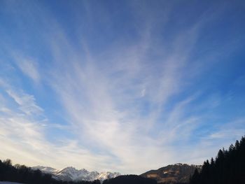 Low angle view of mountain against blue sky