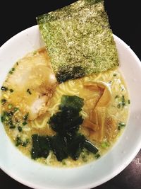 Close-up of serving soup in bowl