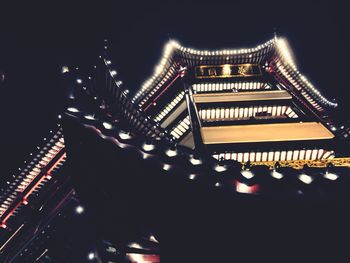 Low angle view of illuminated building at night