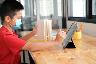 Man working on table at home