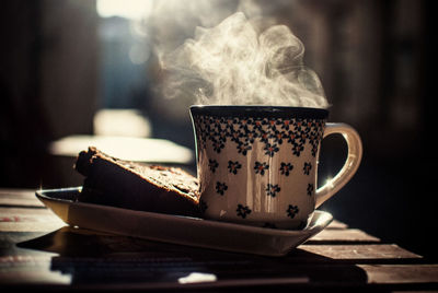 Close-up of coffee cup on table