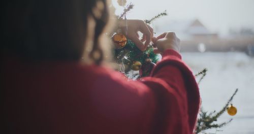 Rear view of woman holding bouquet