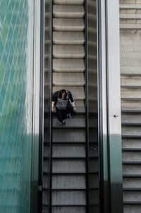 Directly above shot of woman on escalator