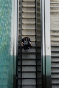 Directly above shot of woman on escalator