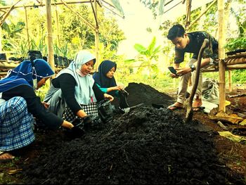 Group of people relaxing on land