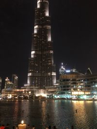 Low angle view of skyscrapers lit up at night