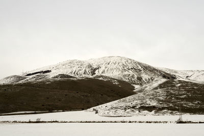 Scenic view of snowcapped mountain against sky