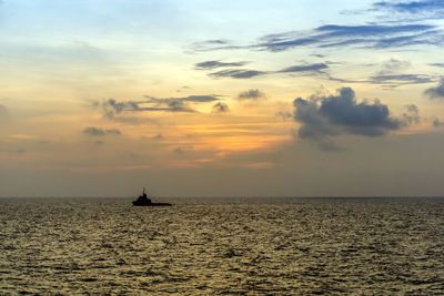 Silhouette of a anchor handling tugboat maneuvering at offshore terengganu oil field