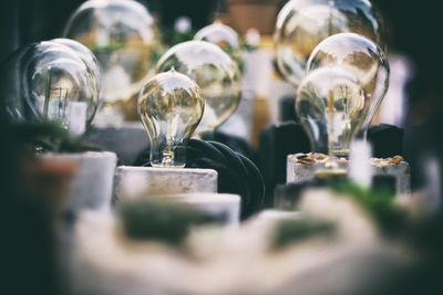 Close-up of wine glasses on table