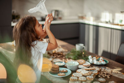 Woman having food at home