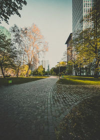 Street amidst buildings against sky