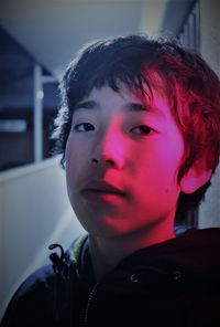 Close-up portrait of young man at home