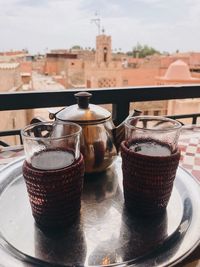 Close-up of mint tea on table against window