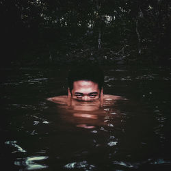 Portrait of man swimming in lake