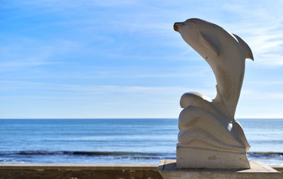 View of horse on beach against sky