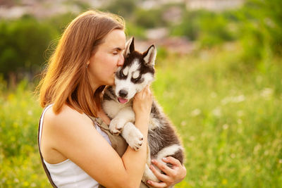 Portrait of young woman with dog