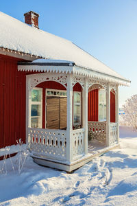 Porch on a red cottage a sunny winter day