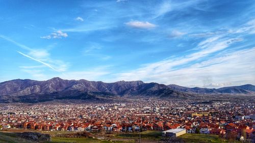Panoramic view of people against sky