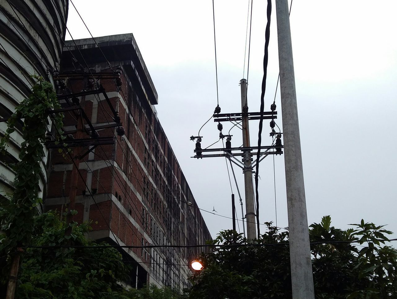 LOW ANGLE VIEW OF ELECTRICITY PYLON IN SKY