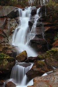 View of waterfall along rocks