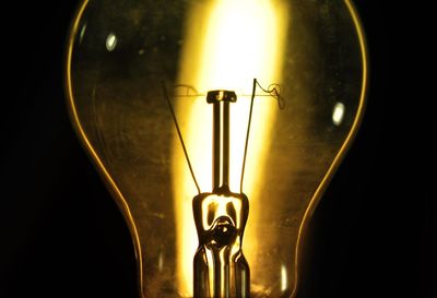 Close-up of illuminated light bulb