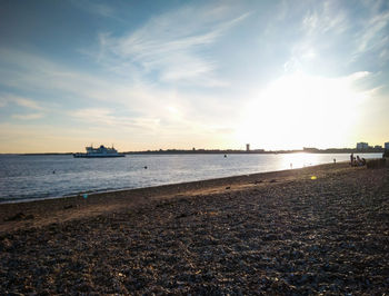 Scenic view of beach against sky during sunset