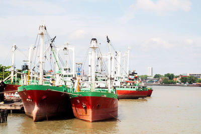 Boats moored at harbor