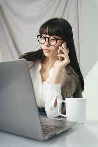 Young woman using mobile phone