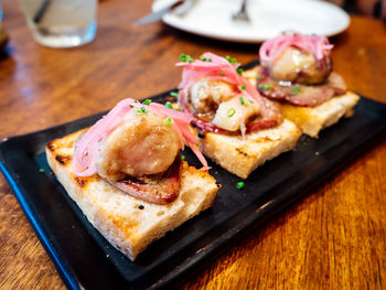 High angle view of fresh tapas served in tray on table