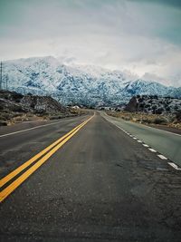 Empty road against sky