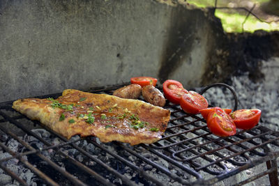 Close-up of meat on barbecue grill