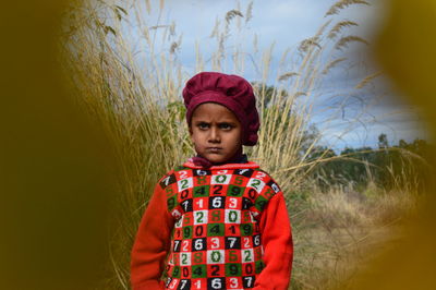 Portrait of boy standing outdoors