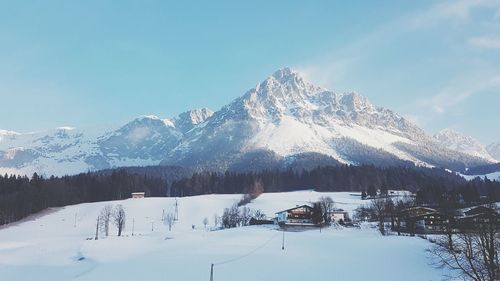 Scenic view of snowcapped mountains against clear sky