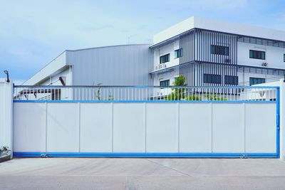 Building by street against sky