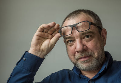 Portrait of man wearing eyeglasses