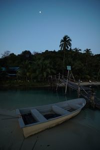 Swimming pool by sea against clear sky