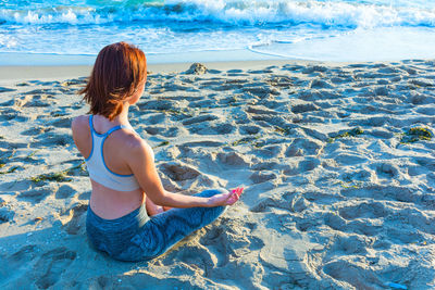 Rear view of woman on beach