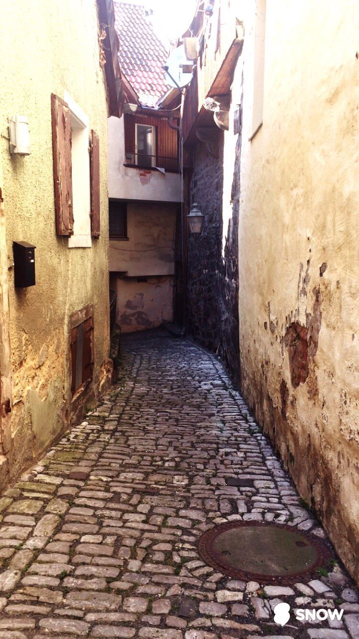 NARROW STREET LEADING TOWARDS HOUSES