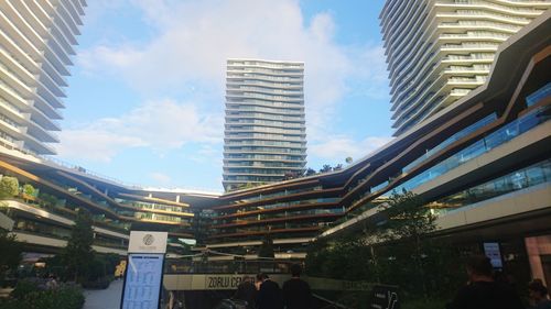 Low angle view of skyscrapers against sky