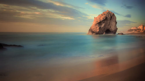 Scenic view of sea against sky at sunset