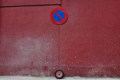 Road sign on wall