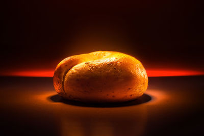 Close-up of orange slice against black background