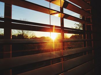 Close-up of window against sky during sunset