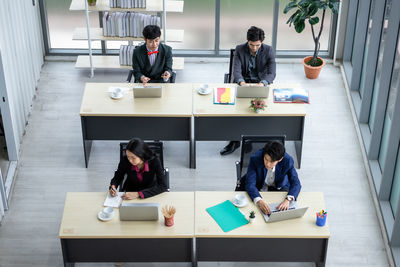 Group of people sitting on table