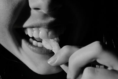 Cropped image of woman eating food