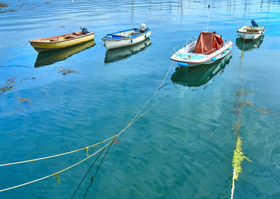 Reflections of boats, masts and clouds in the sea at falmouth, cornwall, k